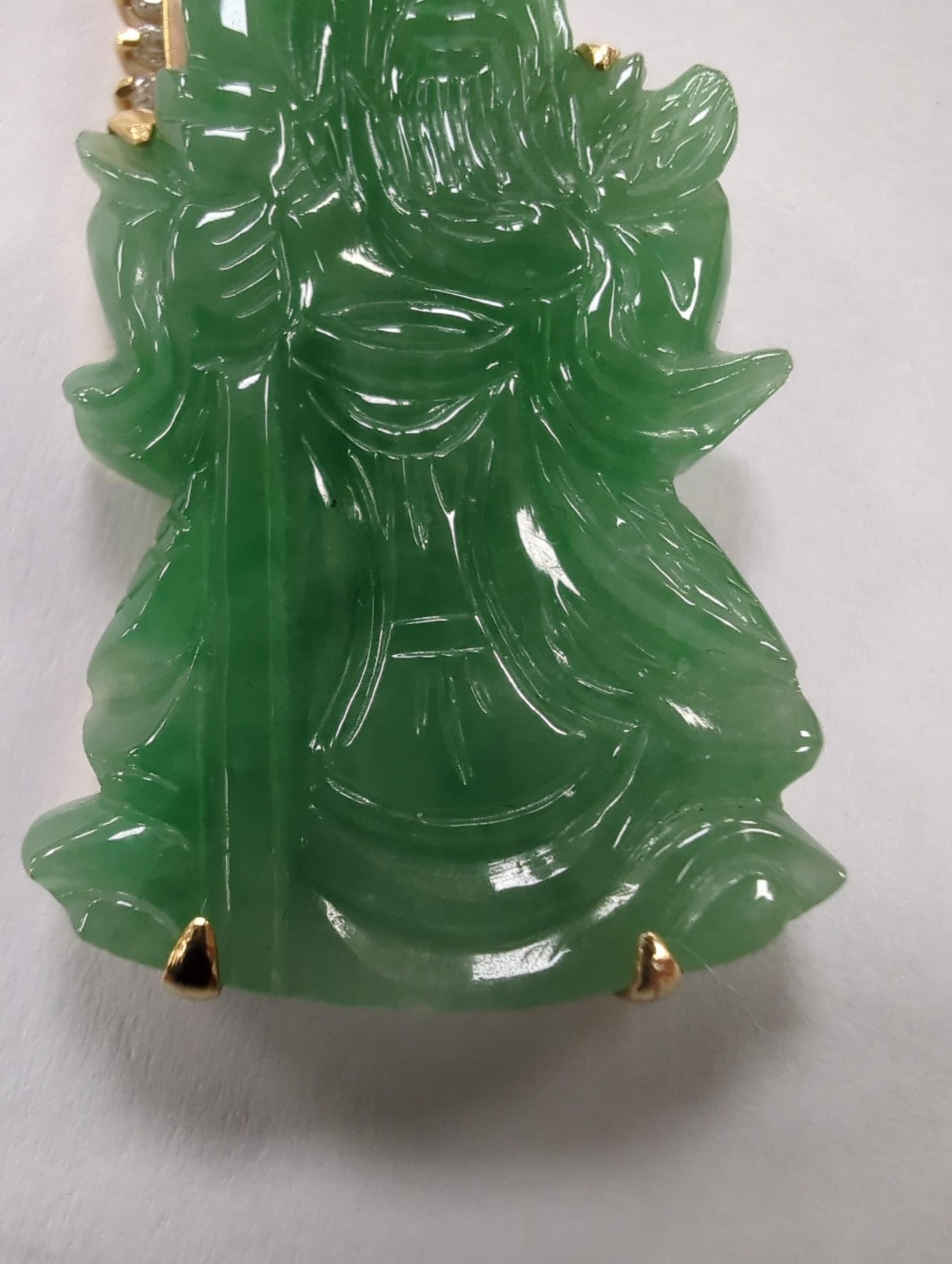 A modern 18k and diamond chip mounted jadeite pendant, carved as an immortal, 40mm, gross weight 9.1 grams.